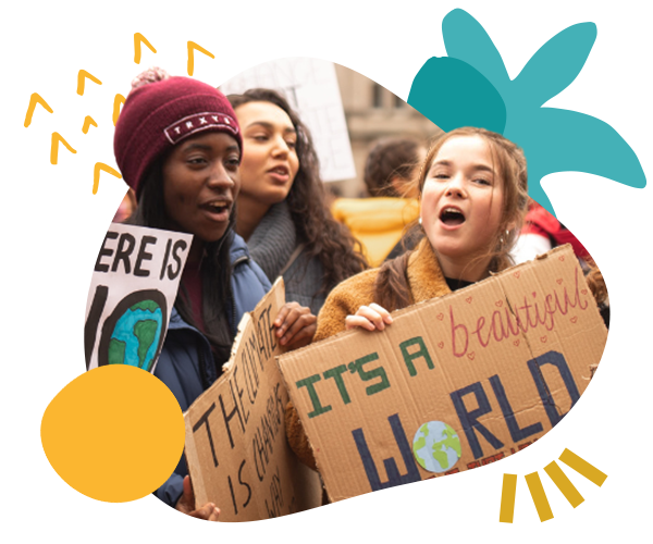 Three young female climate activists at a protest with signs like 